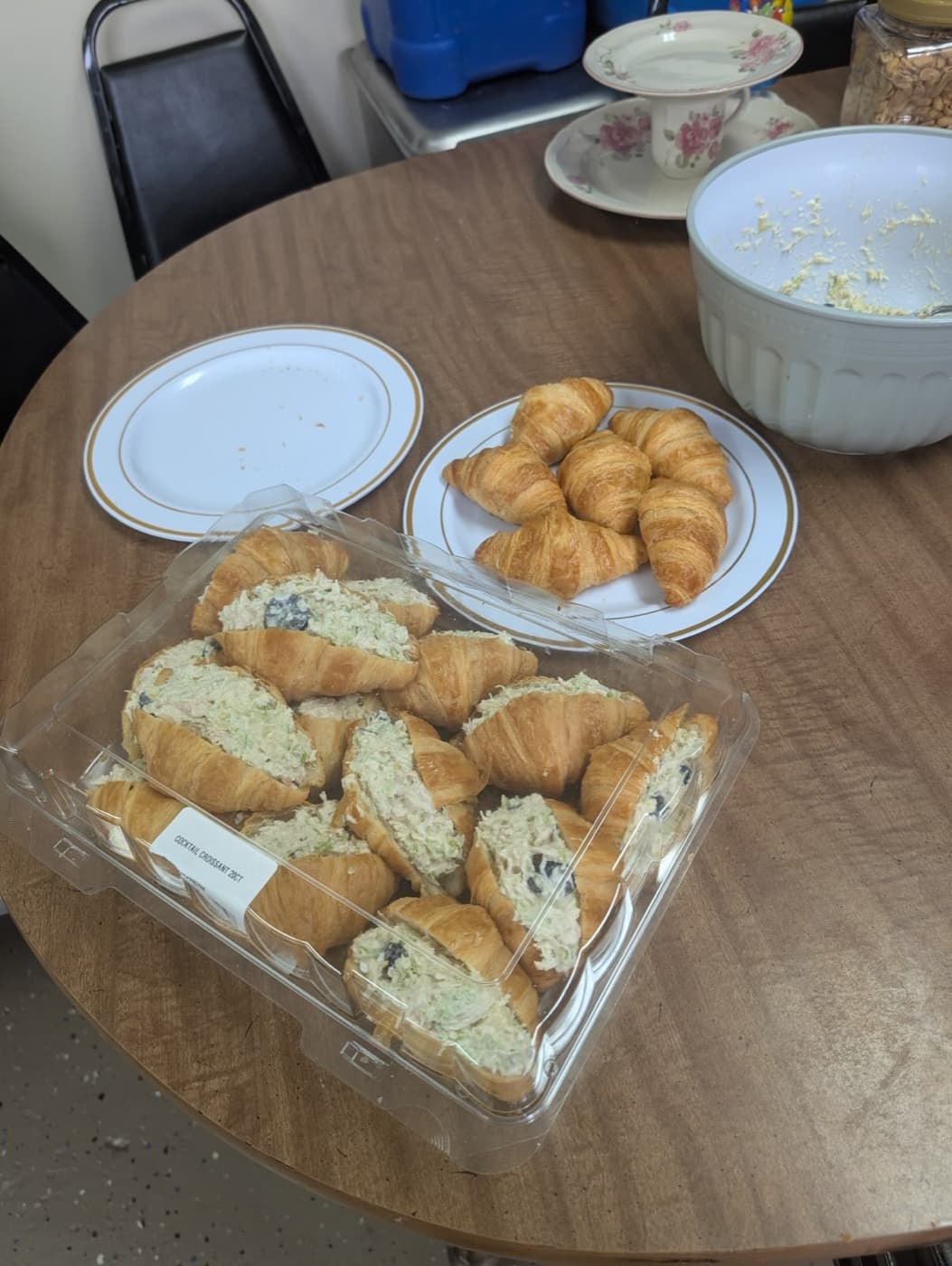 Filled croissants on gold rimmed plates